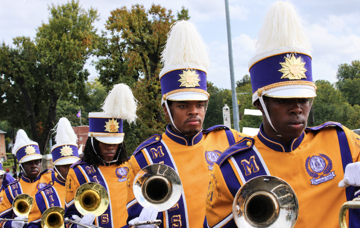 Youth marching band performing at golden hour
